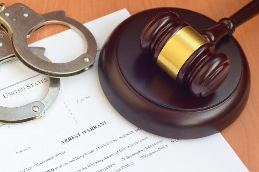 Judges Hammer With Handcuffs On A Table