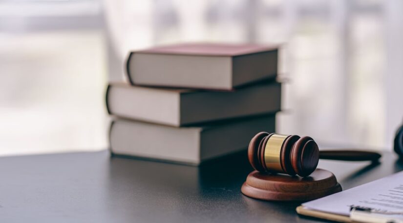 Judges Hammer With Books On A Table